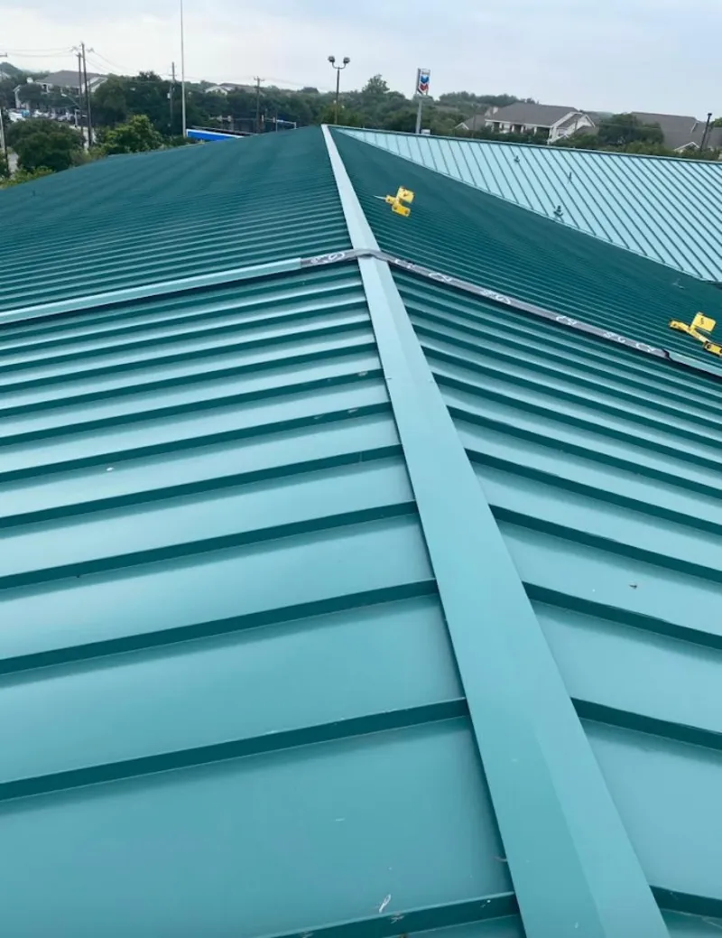 Green commercial metal roof ridge and valley for Metal Roof Repair in Ballwin
