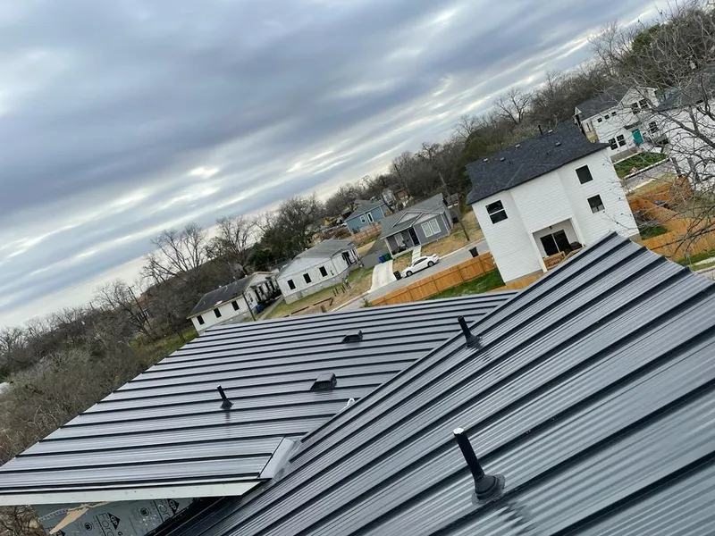Standing seam metal roof panels with vents for Skylight Repair in Ballwin